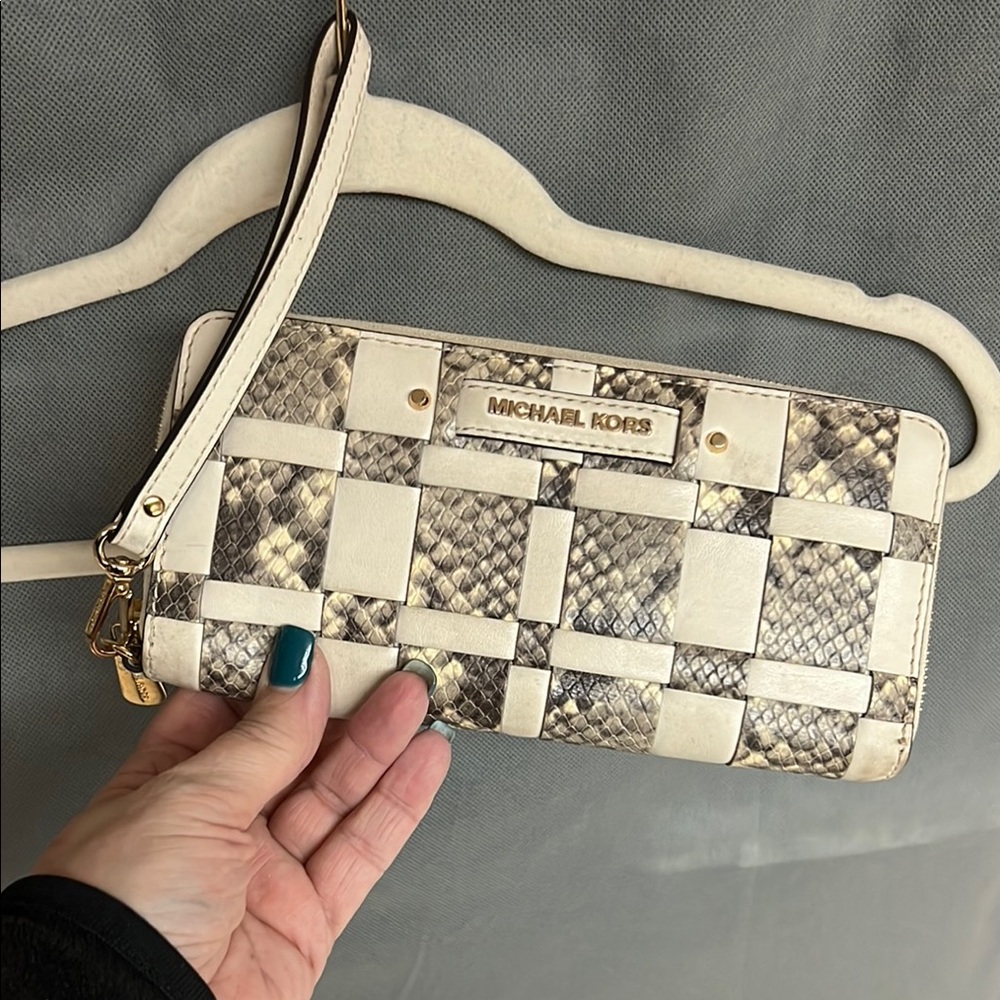 Michael Kors Snakeskin Woven Wristlet. Measures 8.5” x 4.5”.